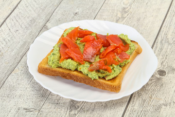 Toast with guacamole and salmon