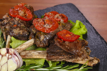 Baked elk meat with tomatoes