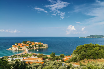 Sunny morning view of Sveti Stefan Island near city of Budva, Montenegro.