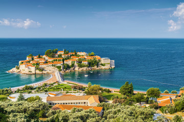 Fototapeta premium Sunny morning view of Sveti Stefan Island near city of Budva, Montenegro.