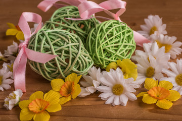 easter eggs in a bouquet of yellow and white lowers