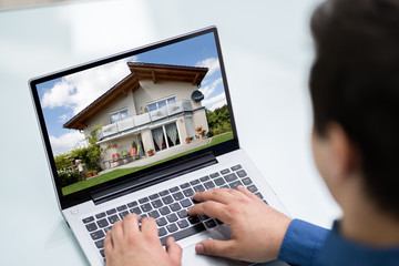 Selecting New House On Laptop