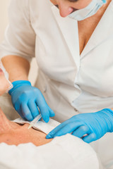 Fototapeta premium The procedure of skin revitalization and the creation of a hydraulic reserve involves the use of preparations based on stabilized hyaluronic acid