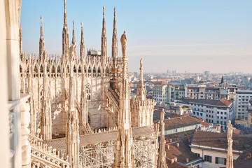 Amazing view of old Gothic spires. Milan Cathedral roof on sunny day, Italy. Milan Cathedral or Duomo di Milano is top tourist attraction of Milan.