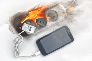power supply burns with fire, phone on recharge, the fire in the apartment. cause of the fire counterfeit charger