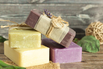 soap of light shades from natural ingredients on a wooden surface