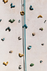 Climbing wall is a wall artificially constructed with grips for hands and feet, specifically prepared to practice the sport of indoor or outdoor climbing