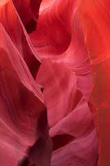 Antelope Canyon, Navajo land east of Page, Arizona. Perfect natural gradient trendy vibrant colors. Tourist place. Beautiful canyon of red purple rocks, creation of nature. Colorful layout for design.