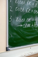 close-up image of part of a blackboard with written chemistry formulas