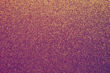 Brocade surface, sparkly fabric. Golden and purple tinsel, metallic shimmer texture of material, glimmering wall background, shiny backdrop.