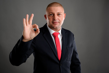 Businessman showing ok sign