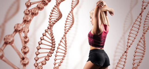 Sporty girl posing among DNA stems. Good metabolism concept.