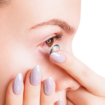 Woman Wears Contact Lenses On Irritated Eyes With Redness.