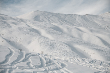 Landscape of snowy slope of the mountain