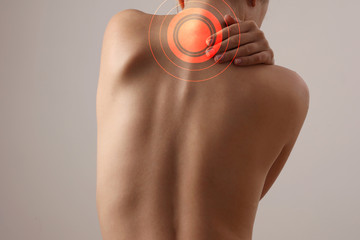 Woman suffering from back and neck pain. Chiropractic, Physiotherapy concept