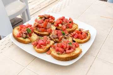 Appetizer of bruschetta with tuna