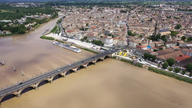 Panoramic aerial view of Libourne city on Dordogne river on sunny summer day, Gironde, France