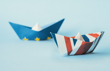 paper ships from the flags of the European Union and the UK - international relations between...