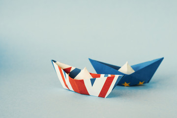 paper ships from the flags of the European Union and the UK - international relations between...