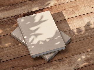 Two Books or Notebooks Mockup with textured kraft paper hardcover on wooden table outdoors