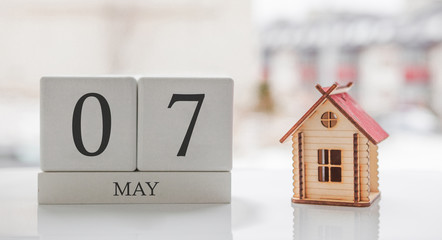 May calendar and toy home. Day 7 of month. Card message for print or remember