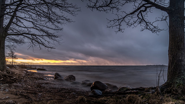 The magical shore of the bay, shrouded in sunset haze.