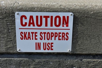 sign warning skateboarders