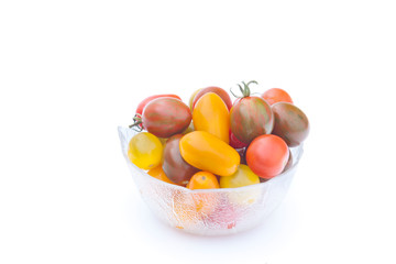 Cherry tomatoes in a bowl isolated on white
