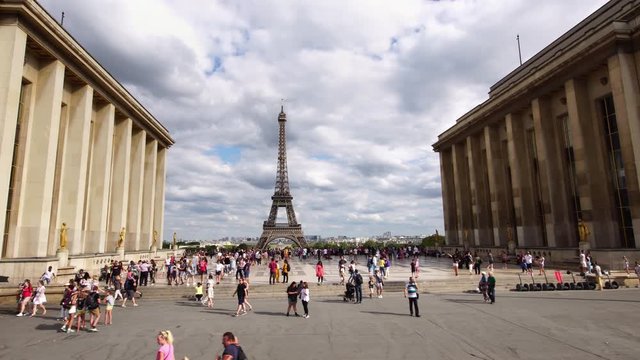 Low angle drone shot of Eiffel tower in Paris. Famous tourist attraction landmark in Paris. Romantic honeymoon travel destination in France.