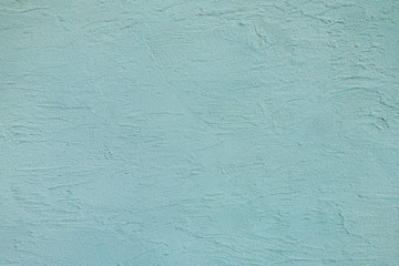 こて跡の残る青い壁の背景テクスチャー