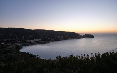 Sunup on calamosca beach from capo sant'Elia lighthouse