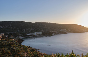 Sunup on calamosca beach from capo sant'Elia lighthouse