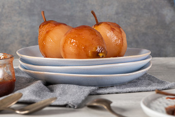 Poached pears delicious home made recipe over light kitchen countertop
