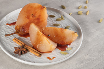 Poached pears delicious home made recipe over light kitchen countertop