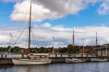 Fototapeta na wymiar Roskilde, Denmark, Wooden boats and yachts in fjord