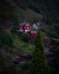 red house in woods in norway