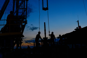 field oil workers at work