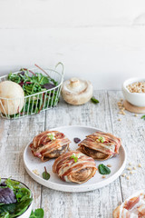Baked mushrooms stuffed with cheese and pine nuts