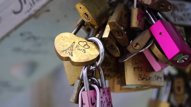 Eiffel Tower Paris on padlocks love locks on the bridge. Romantic honeymoon travel destination in France. Tourism attraction & famous landmark. 