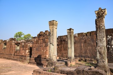 lone pillars in front of old broken crumbling ancient ruins of angkor wat, cambodia