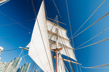 Fototapeta premium Old wooden ship. System of ropes, cables and chains, which support a sailing ship's mast