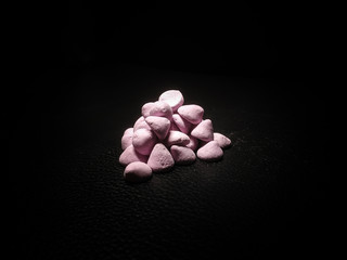 Purple sponge candy isolated on black background