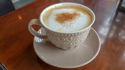 coffee cappuccino cinamon and sugar on the top