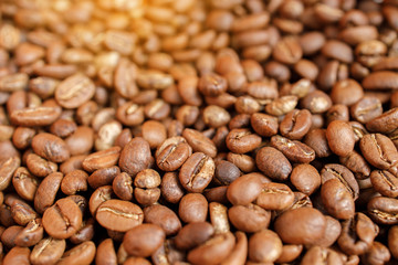 roasted coffee beans in bowl on wooden
