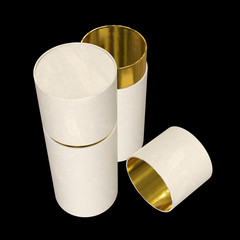 Kraft paper cardboard tube package with gold part mock up. 3d render on black background.