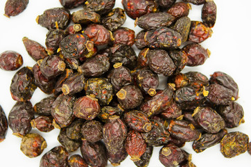 Rosehip fruit, dried fruit close-up on a white background. Healthy food, vegetarianism.