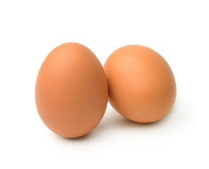 Raw chicken eggs isolated on the white background.