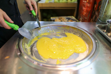 Making fried ice cream from mango and banana