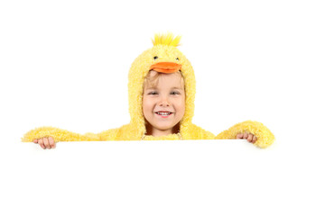 Young smiling boy in a baby chick costume with room for text below