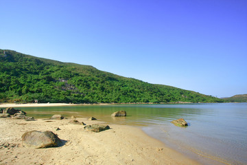 30 Nov 2008 Hoi Ha Wan, bushes all over the mountain and a gulf.